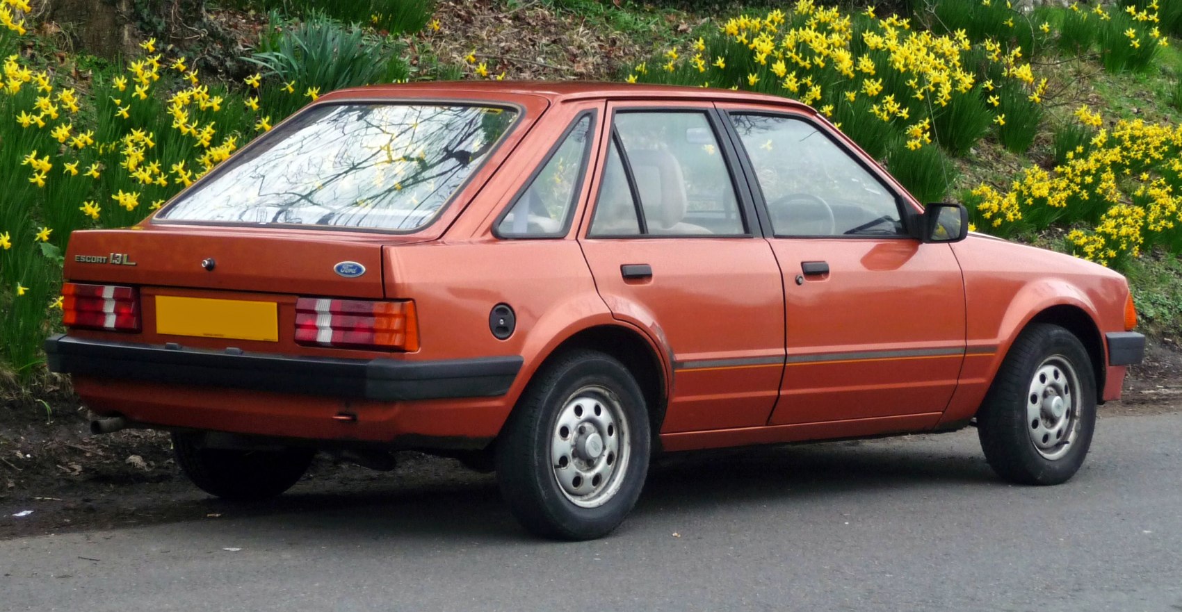Rear and side profile with vintage hatchback and tail lights