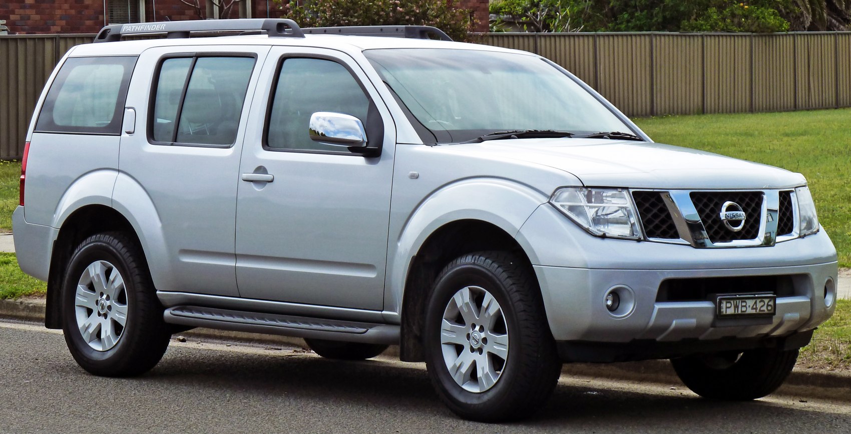 Silver SUV with front side view and rugged design.