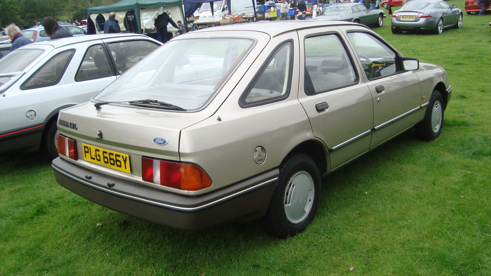 1983 hatchback rear and side profile with visible tail lights and classic wheel covers