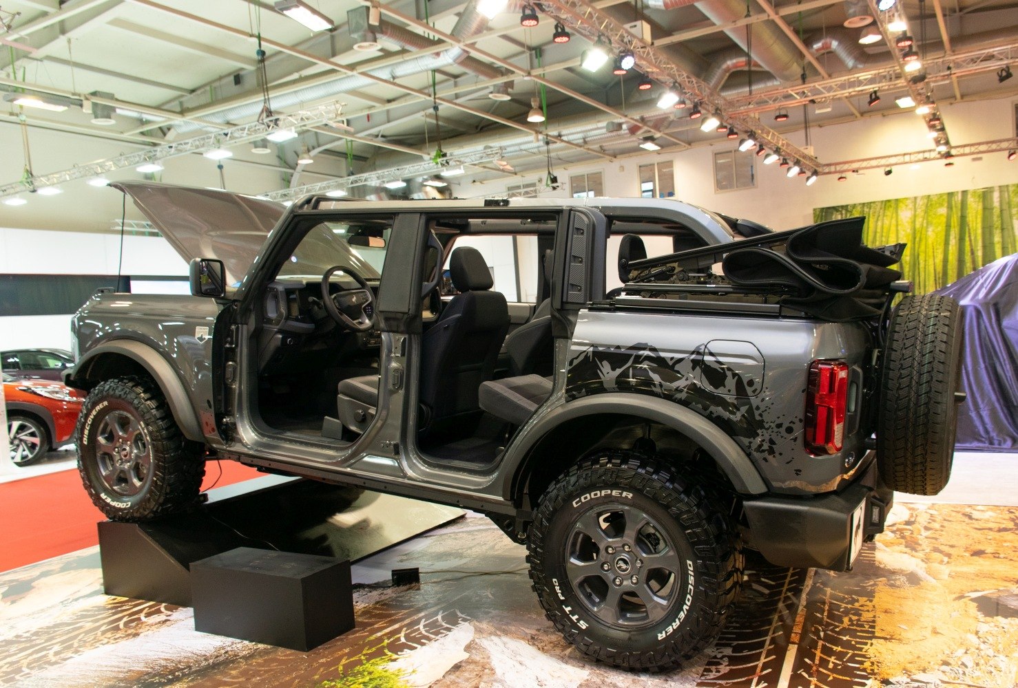 SUV with open doors and folded soft top