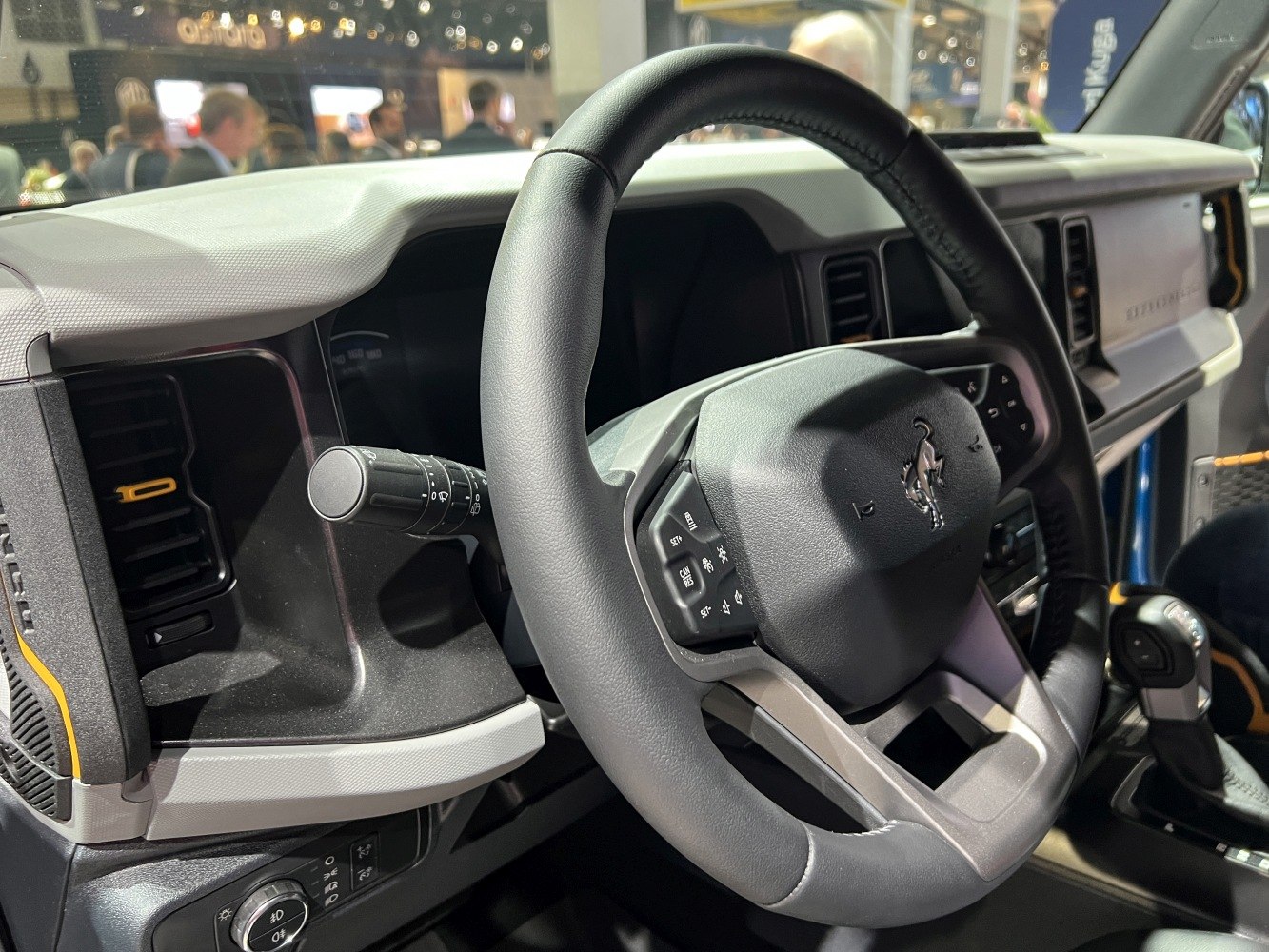 Steering wheel and dashboard with controls in SUV interior