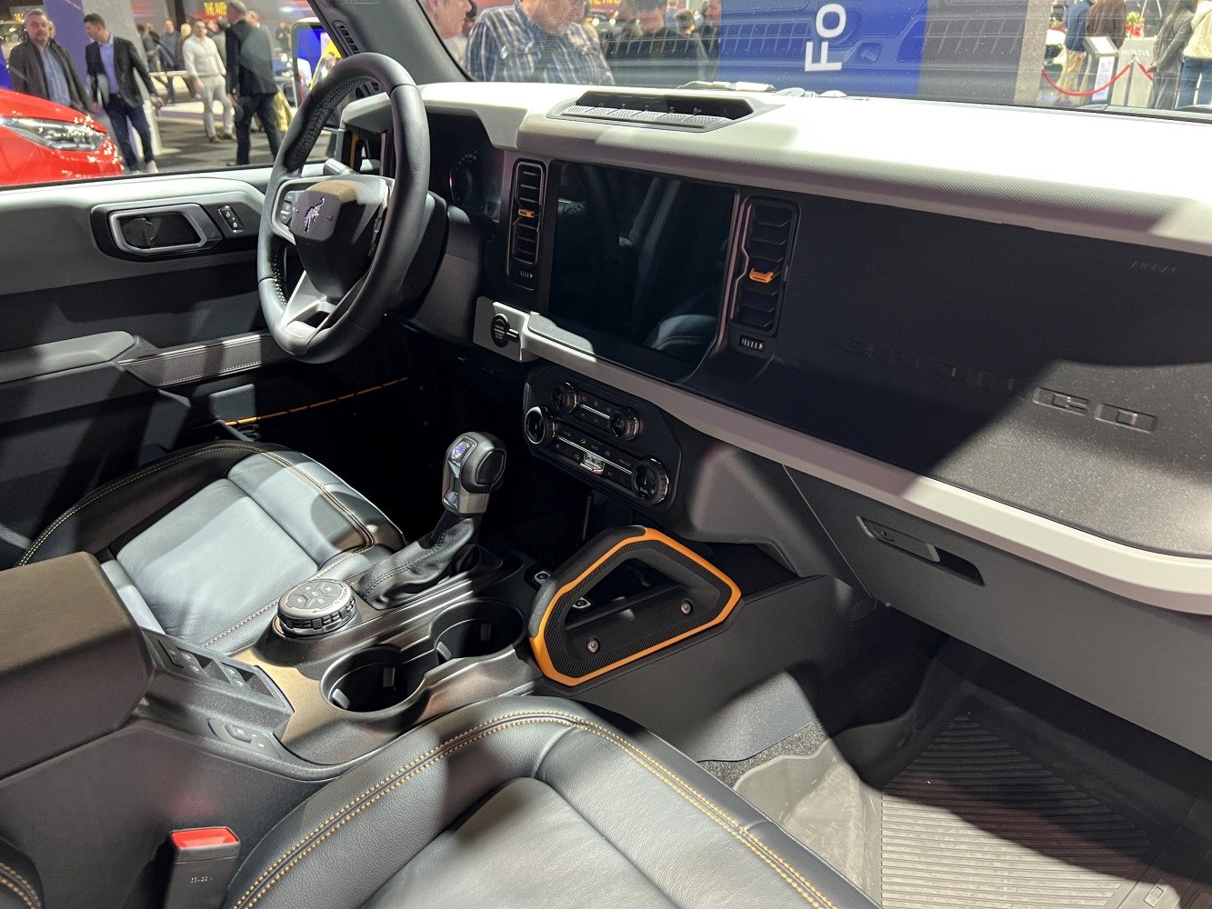 Modern SUV interior with dashboard, steering wheel, and center console