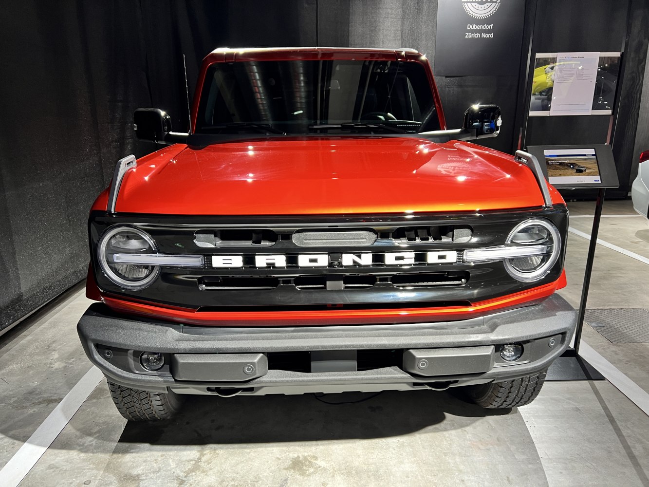 Bold front grille and round headlights of a rugged SUV