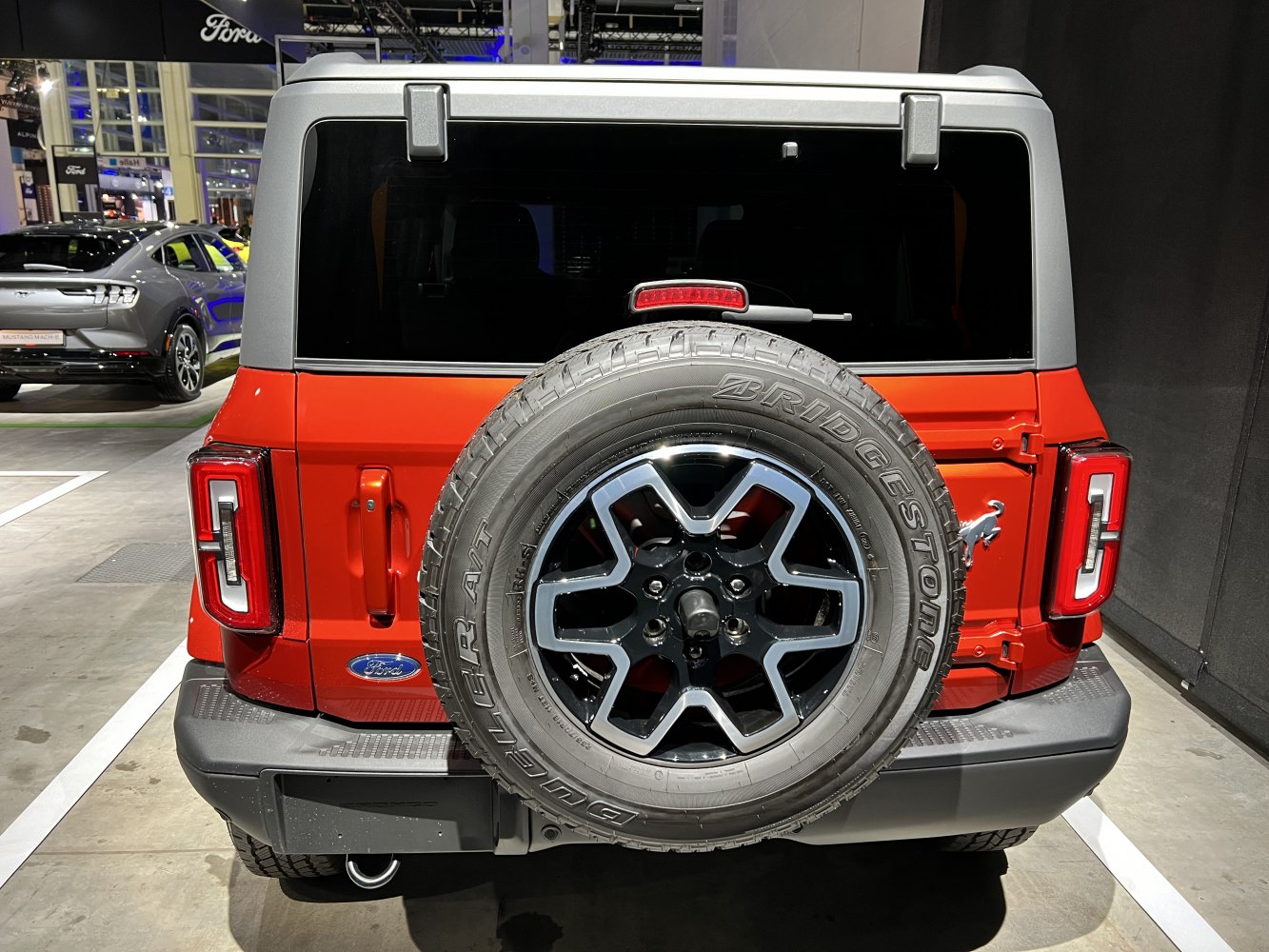 Rear view with spare tire mounted on tailgate and distinct rear tail lights