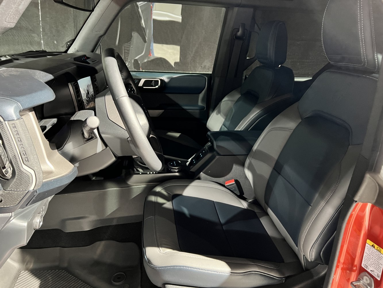 Modern SUV interior with dashboard and premium front seats