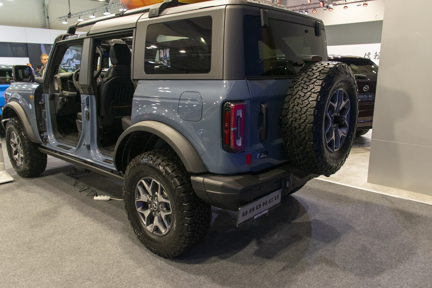 Rear and side view with off-road tires and open doors