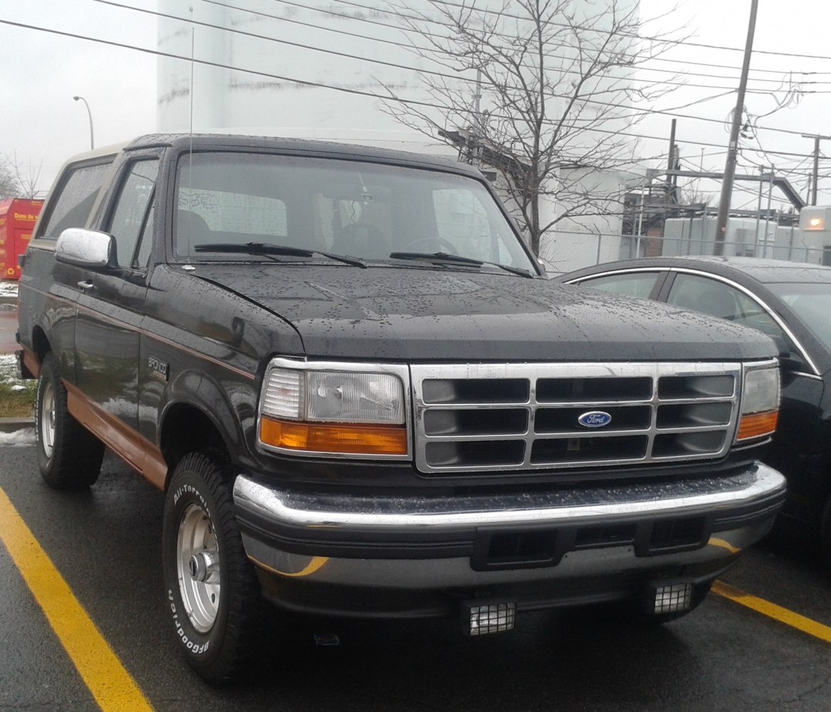 Front view of rugged SUV with distinctive grille and off-road tires