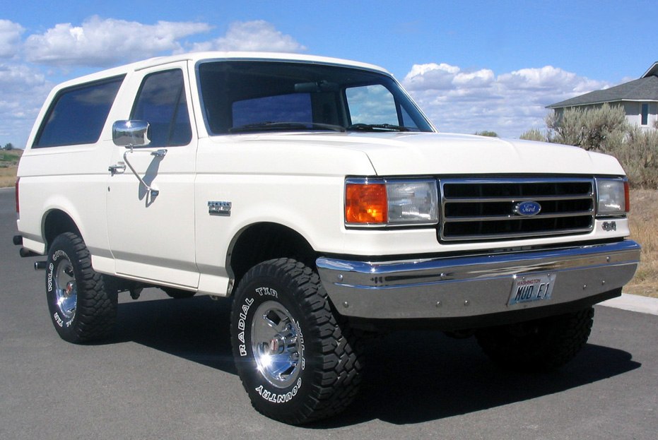 Classic SUV with robust off-road tires and chrome details.