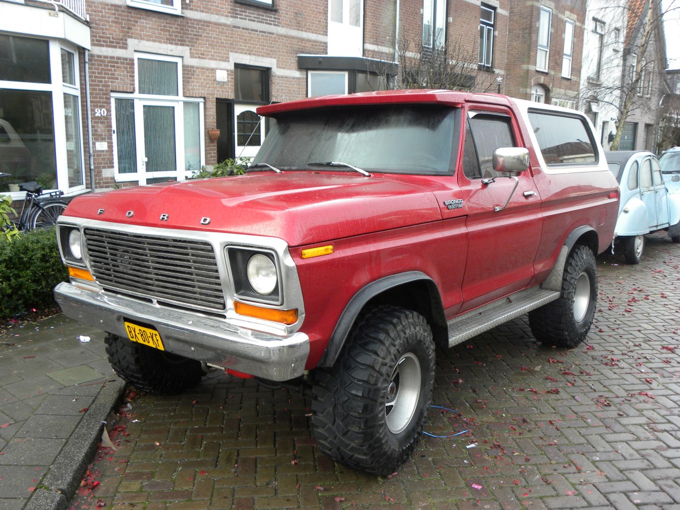 Large off-road tires and elevated suspension with rear cargo cover