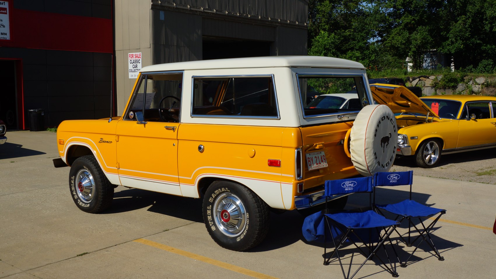 Vintage off-road SUV with rear spare tire cover and two-tone orange-white paint