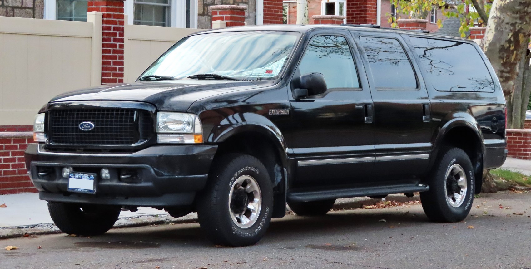 Black large SUV with bold front grille and rugged tires