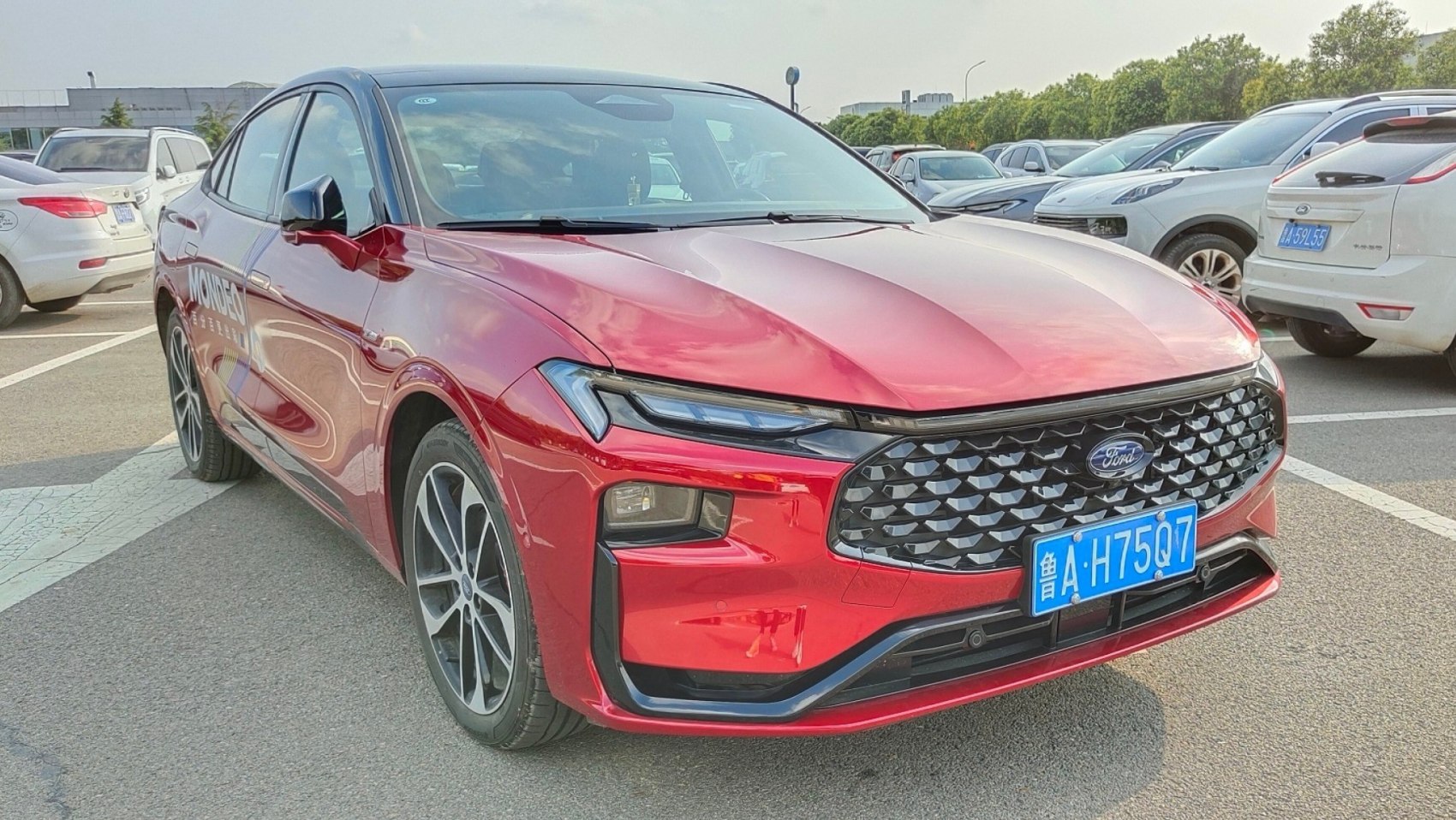 Front view with LED headlights and distinctive grille
