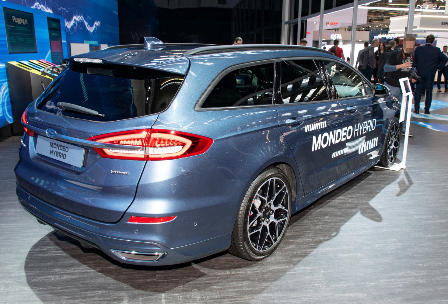 Rear and side view of hybrid wagon with LED taillights and alloy wheels