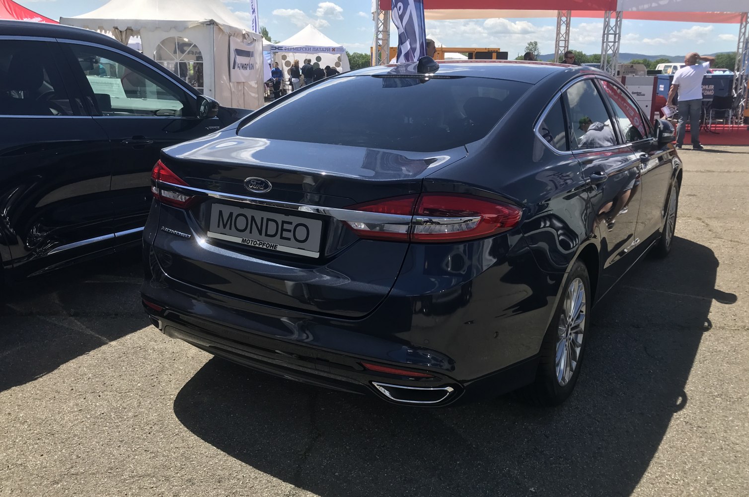 Rear view of a 2019 facelift sedan with distinct taillights and trunk styling