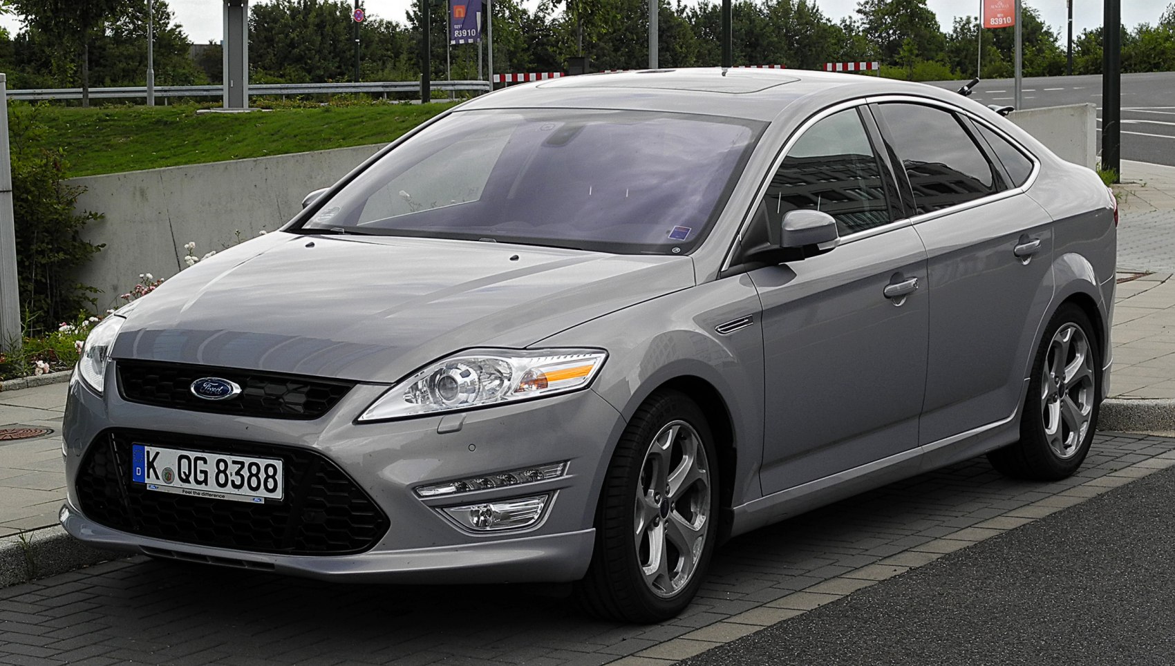 Front and side view of hatchback with modern headlights and alloy wheels