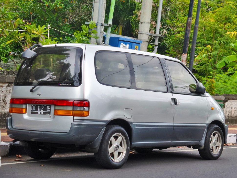 Rear and side view of a minivan with tinted windows and alloy wheels.