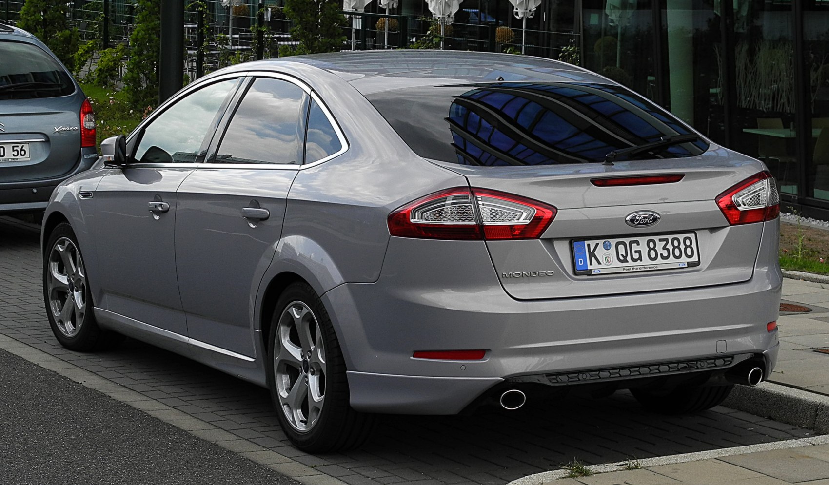 Silver hatchback rear with distinct tail lights and dual exhaust pipes