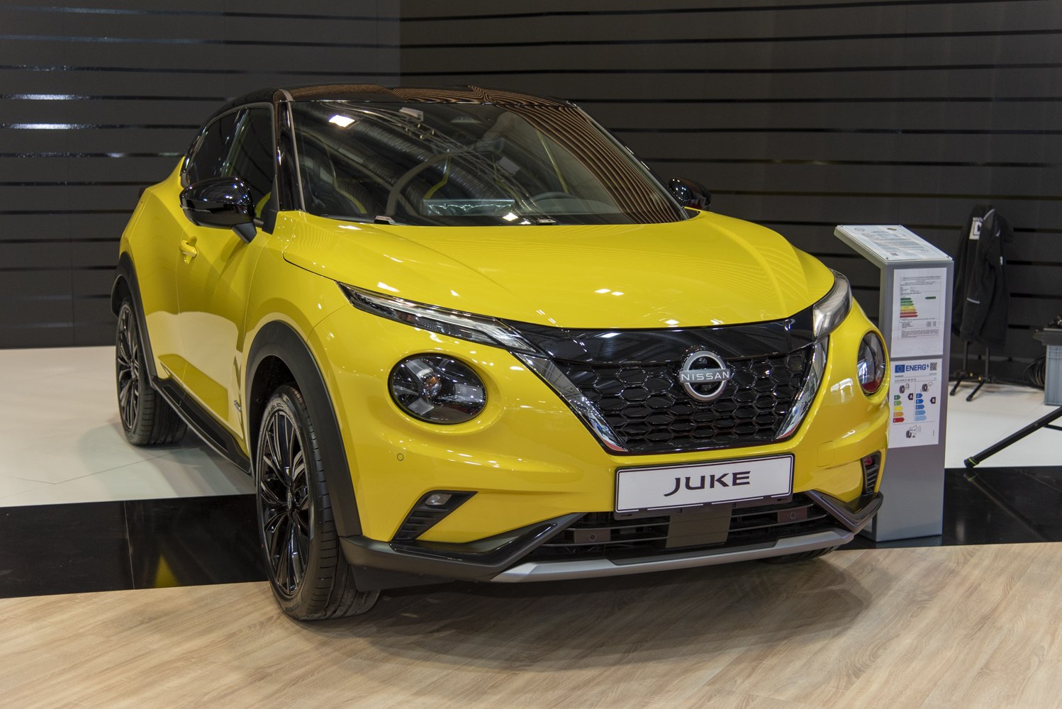 Front view of vibrant yellow compact SUV with updated grille and sleek headlights