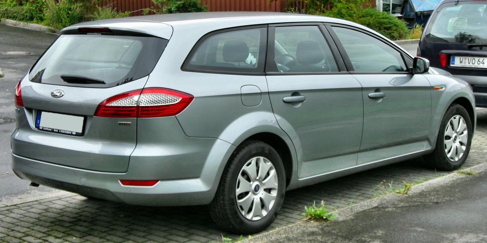 Silver wagon showing rear and side view with distinctive tail lights