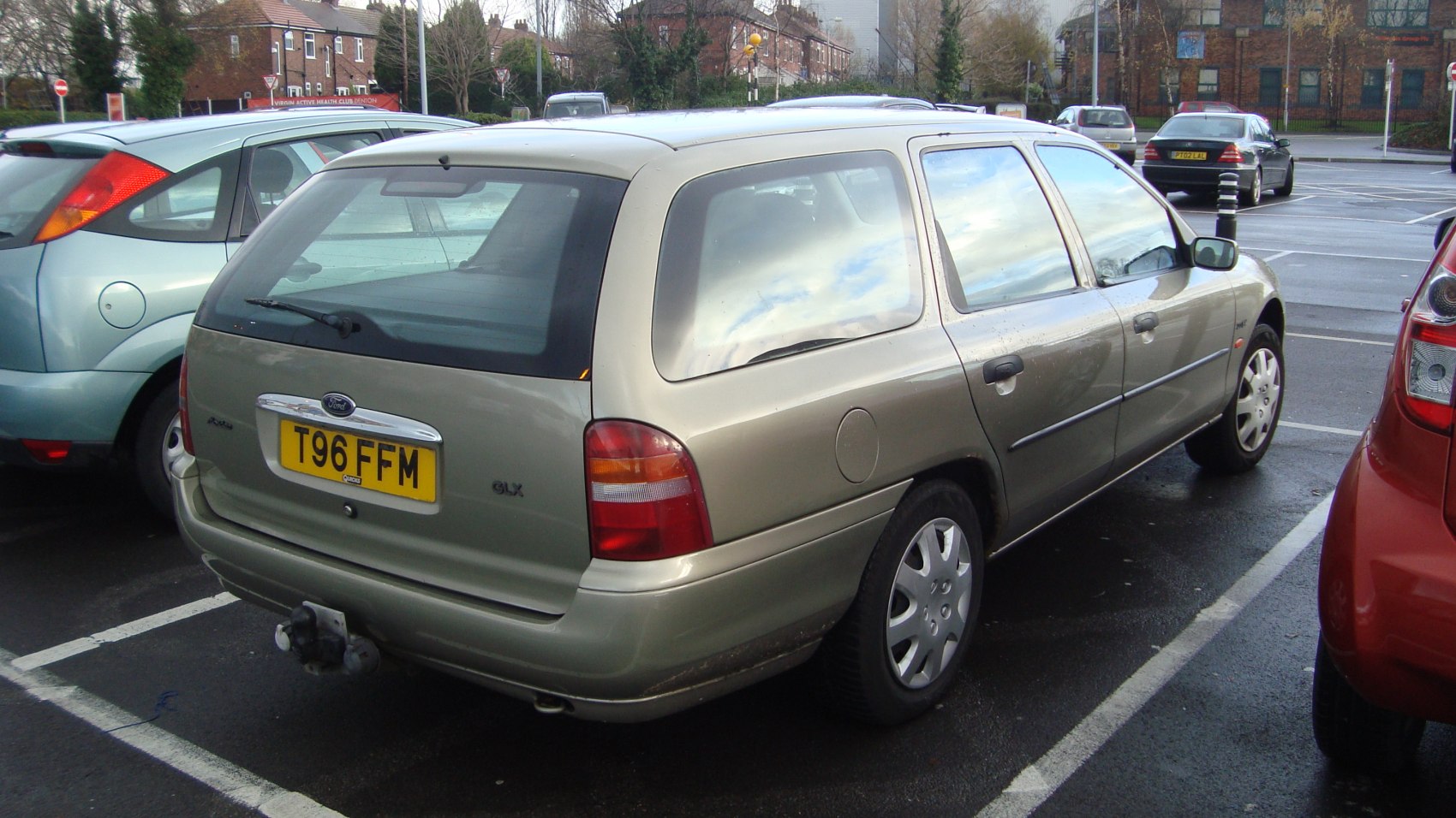 Rear and side view of a 1996 station wagon with distinct tail lights and hatchback design