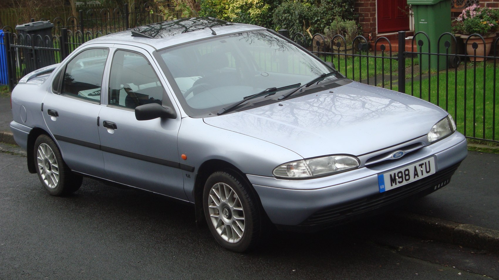Silver mid-1990s sedan front and side perspective