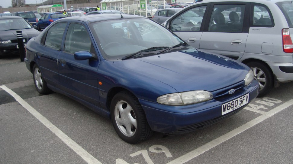 Front-side view of classic hatchback with rounded headlights and aerodynamic shape