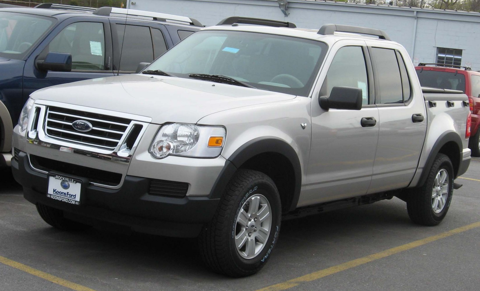 Mid-size pickup truck front three-quarter view with crew cab and roof rails