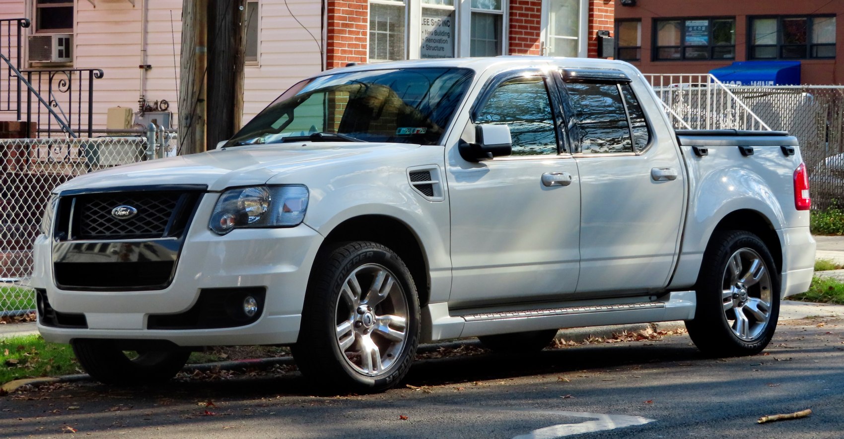 White pickup truck with crew cab and bed cover
