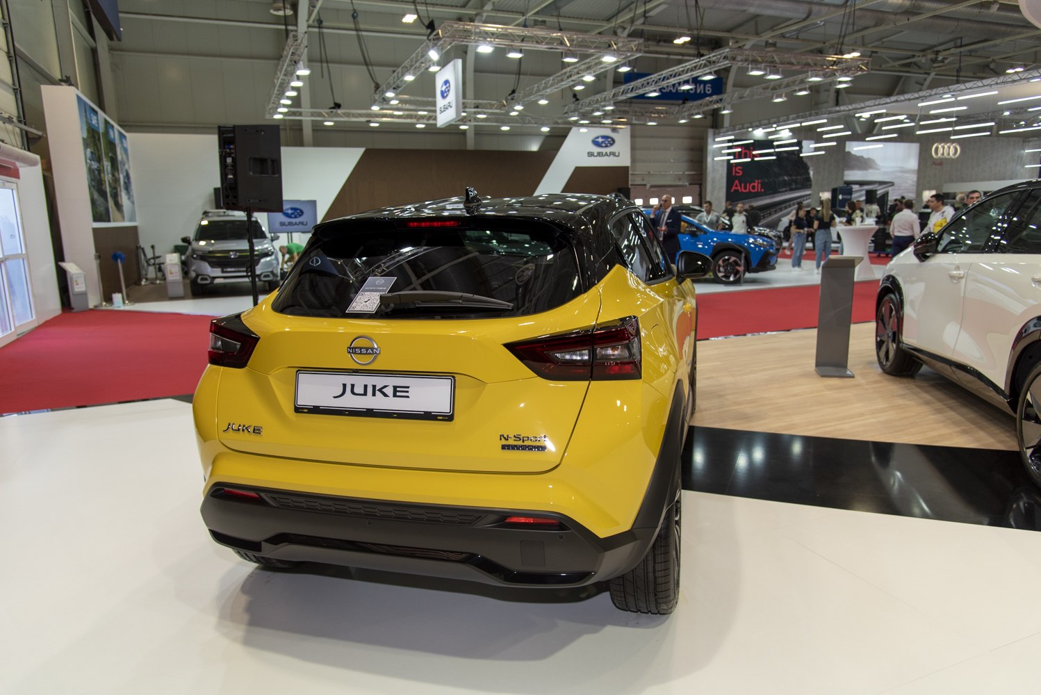 Yellow and black two-tone rear view with distinct tail lights