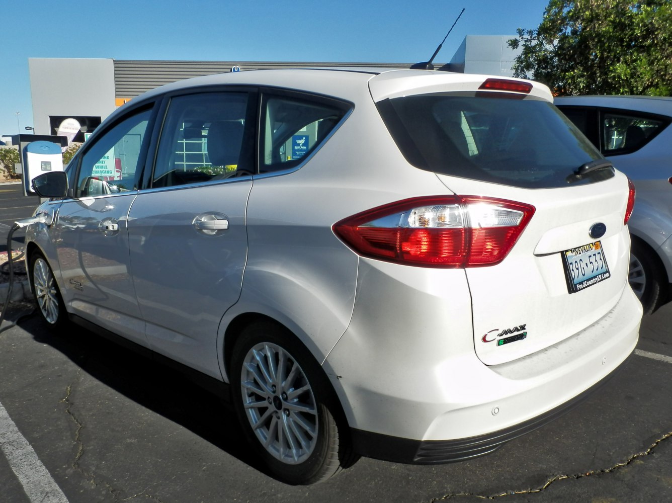 Rear and side profile with charging connection at parking spot