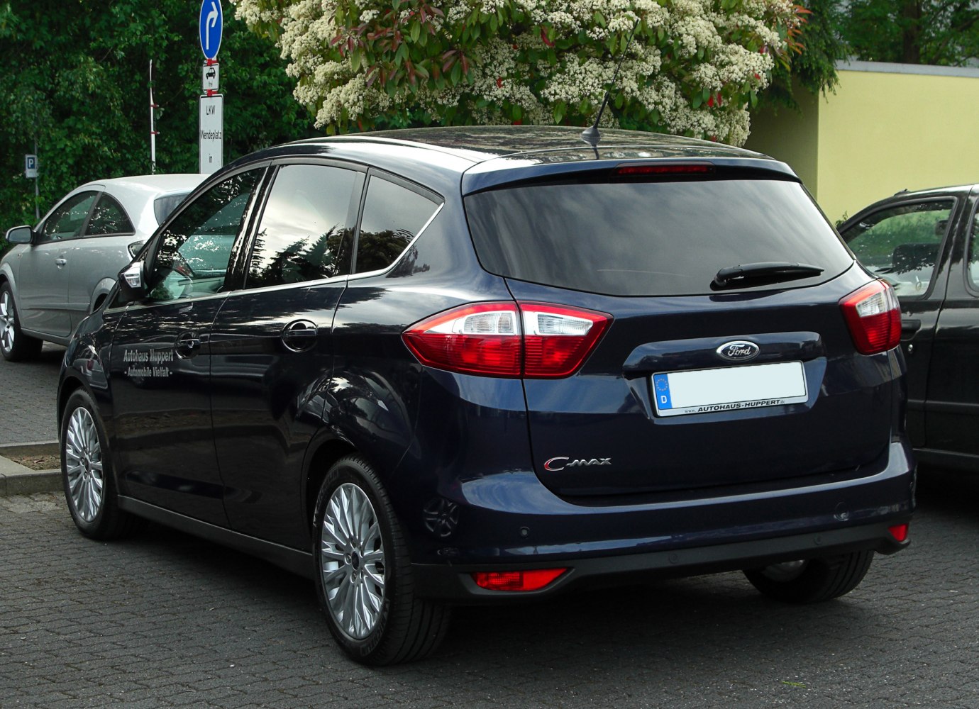 Rear view of hatchback with distinctive tail lights and dark blue color