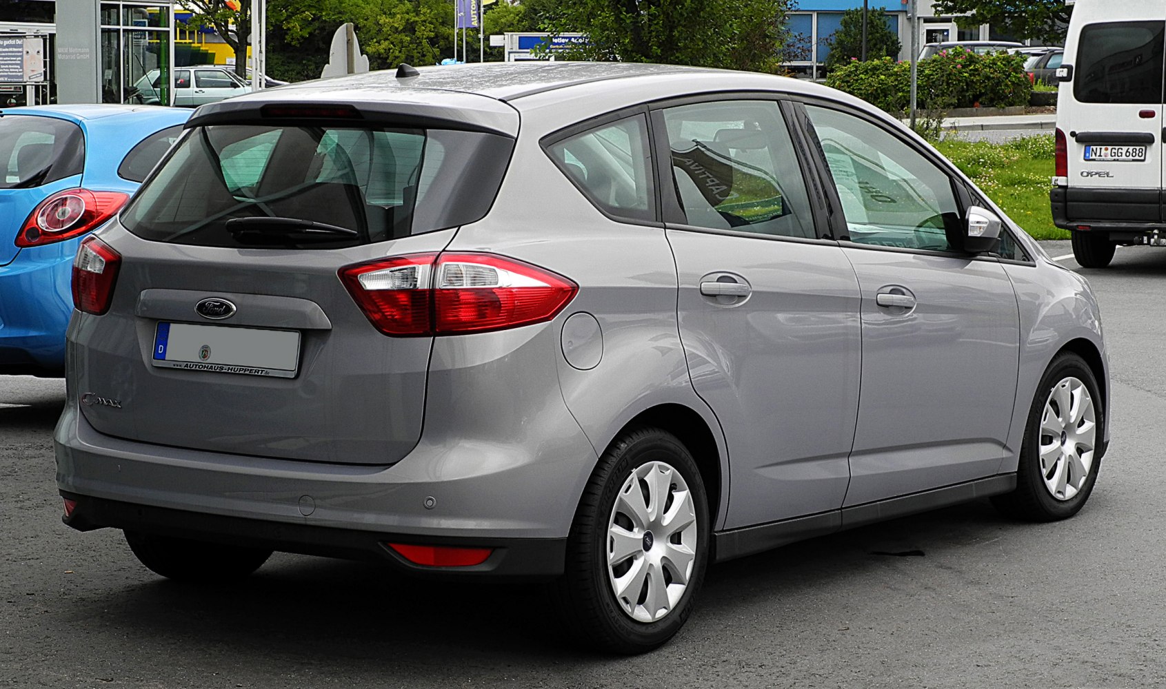 Rear and side profile of gray compact MPV with taillights and multi-door design