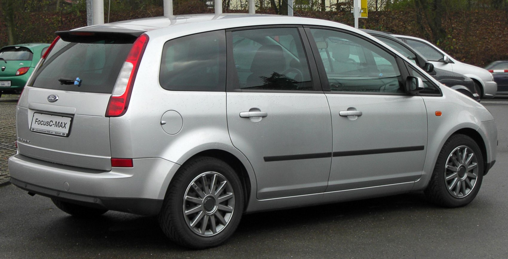Silver compact MPV rear side view with alloy wheels and vertical tail lights