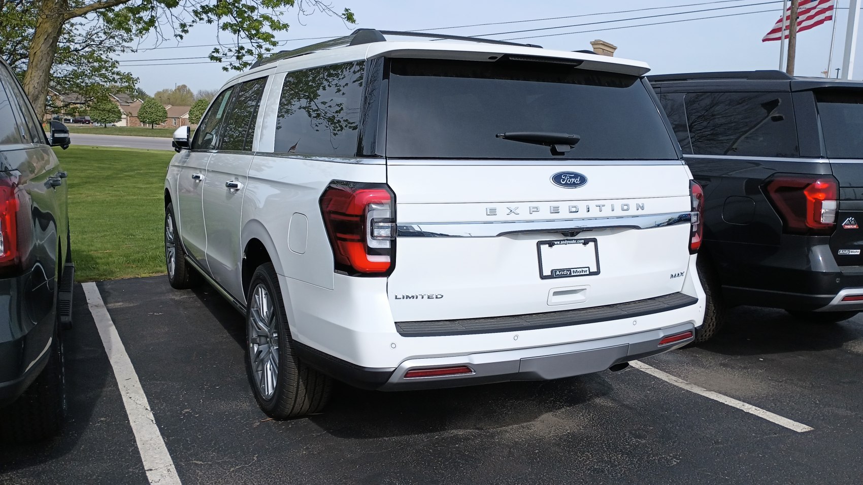 Rear design of a full-size SUV with distinctive tail lights and tinted windows