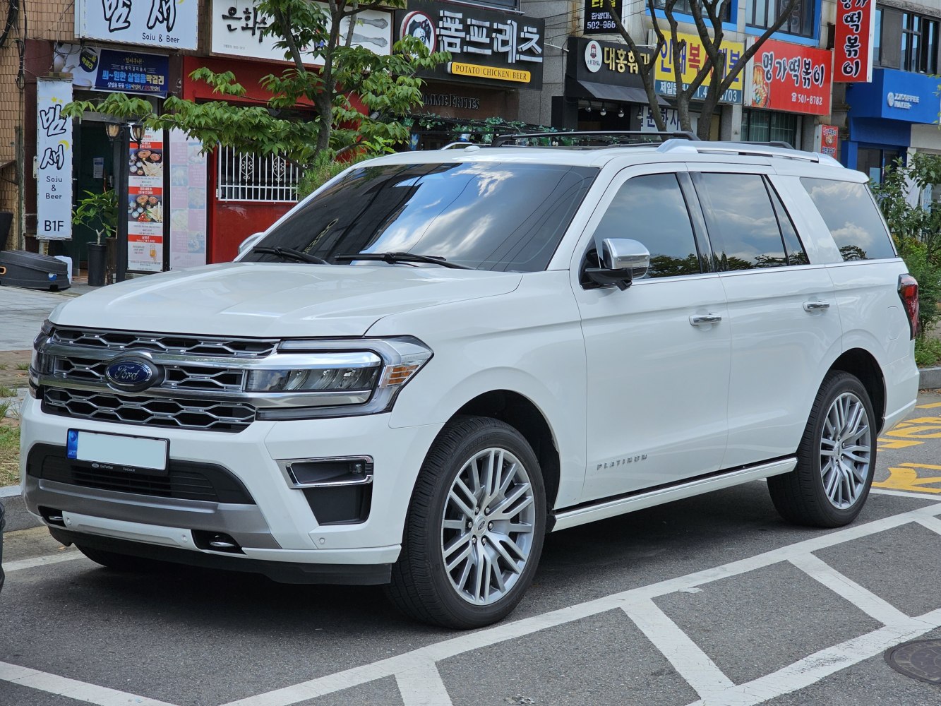 Large luxury SUV with bold grille and LED headlights