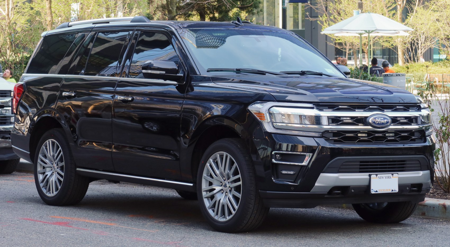 Large black SUV with modern grille and alloy wheels