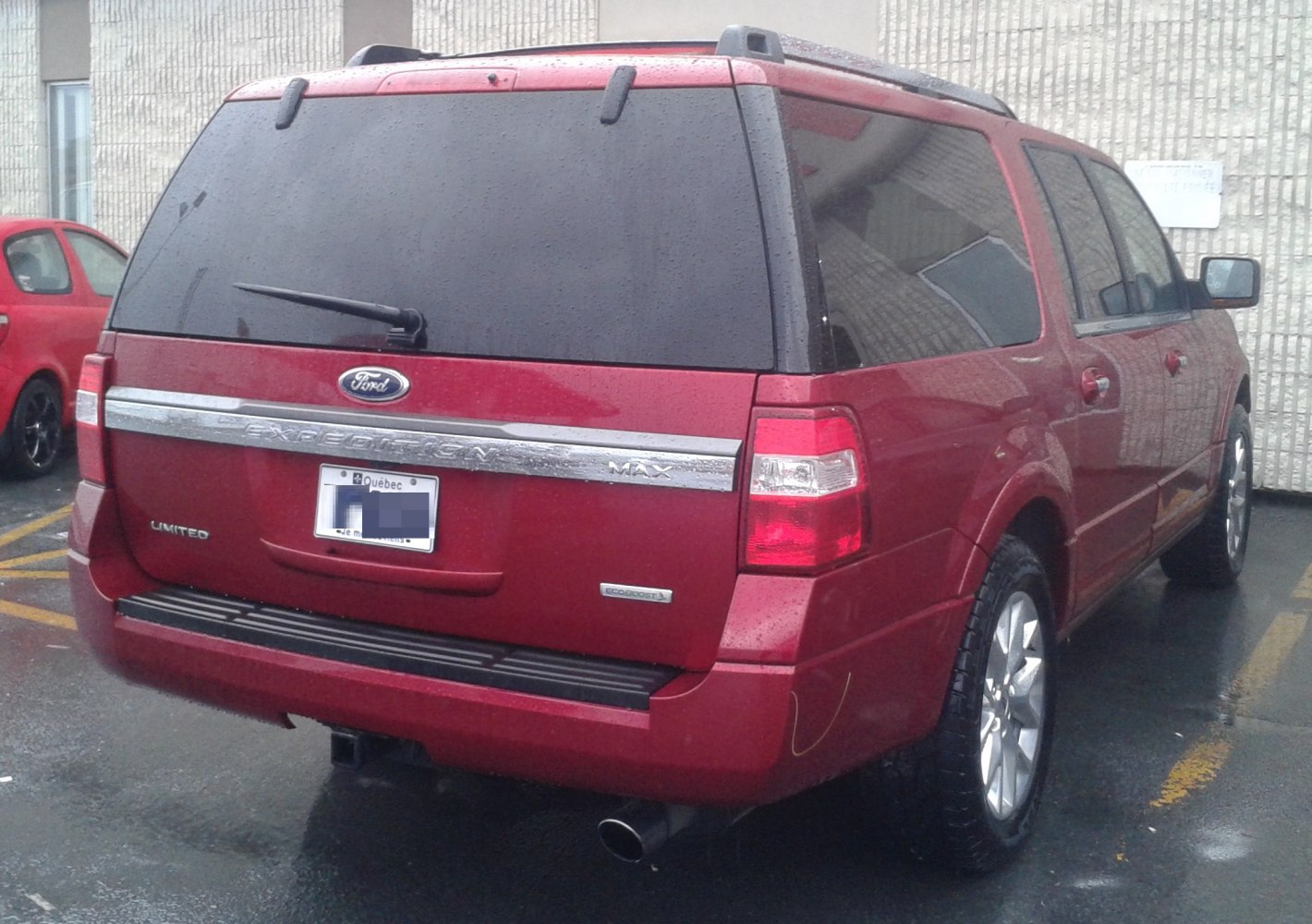 Rear view of SUV with tinted windows and tow hitch
