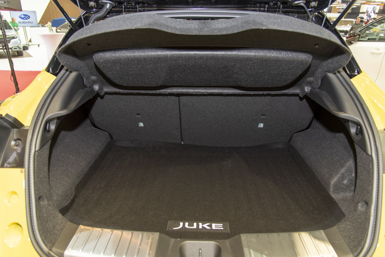 Spacious trunk with foldable rear seats and carpeted cargo area
