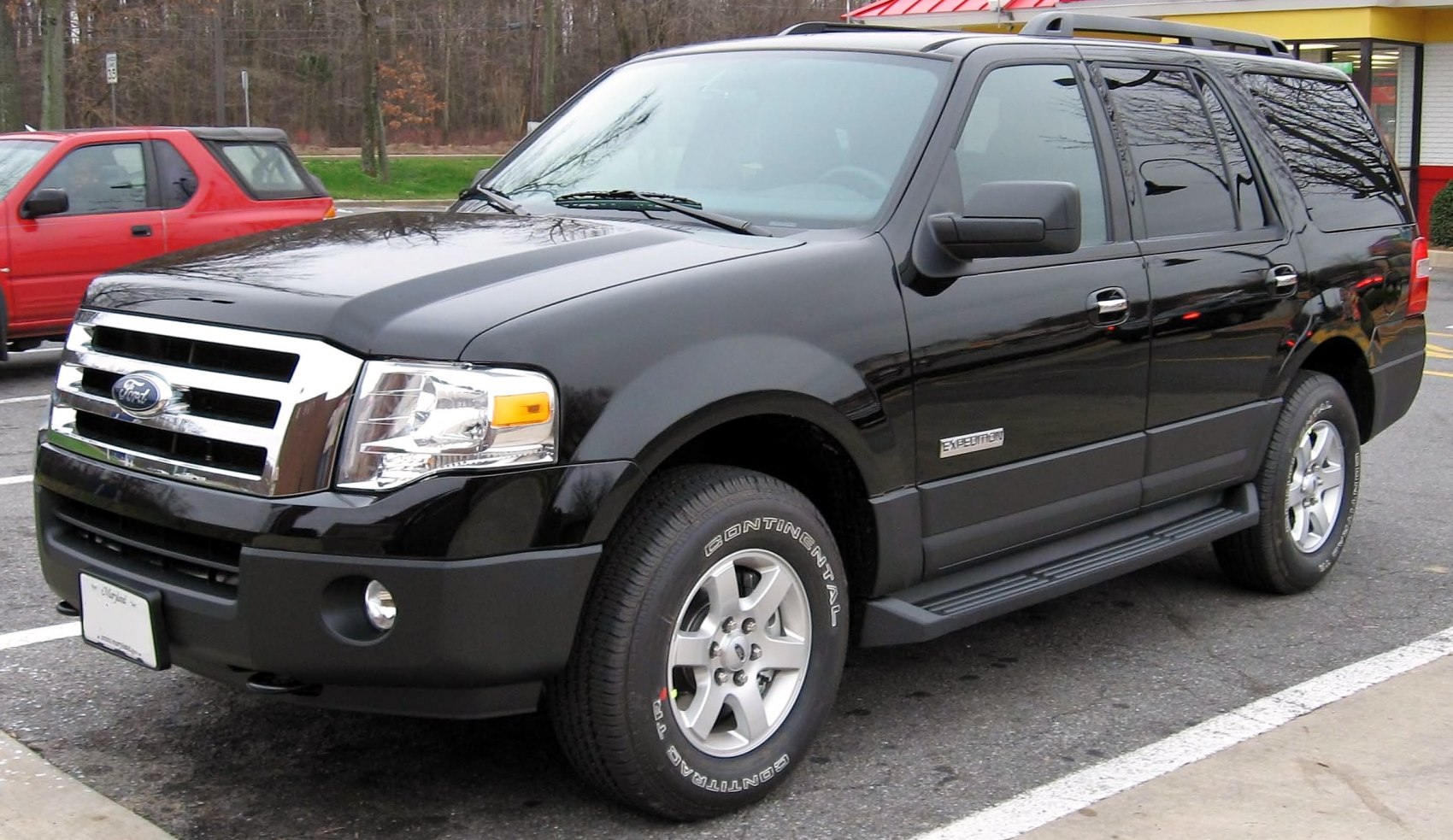 Black SUV with chrome grille and alloy wheels
