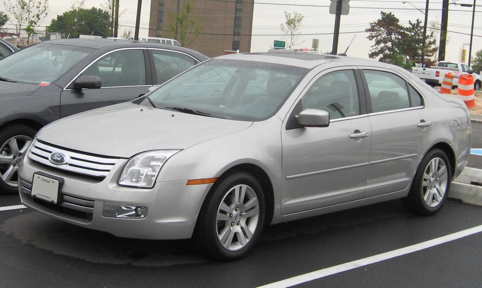 Silver sedan with distinctive grille and multi-spoke alloy wheels