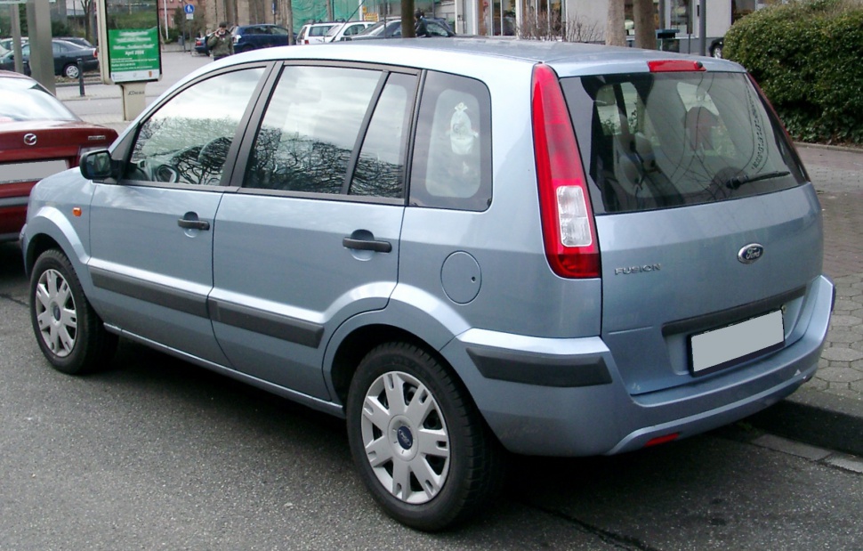 Rear view with vertical tail lights and hatchback design