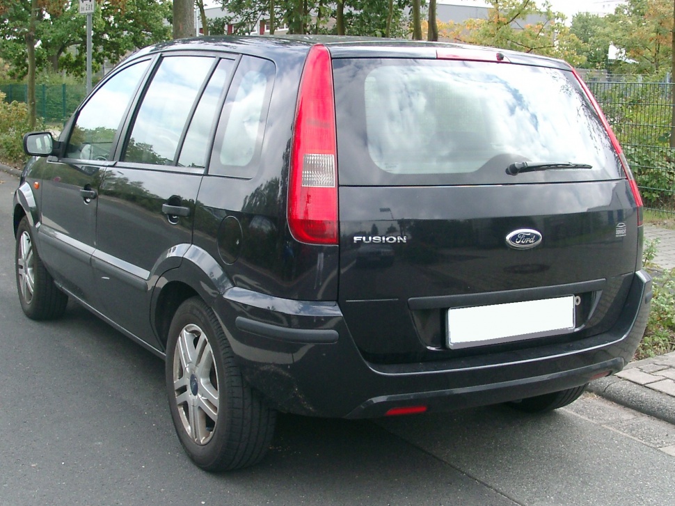Rear and side view showing tail lights and alloy wheels on compact hatchback