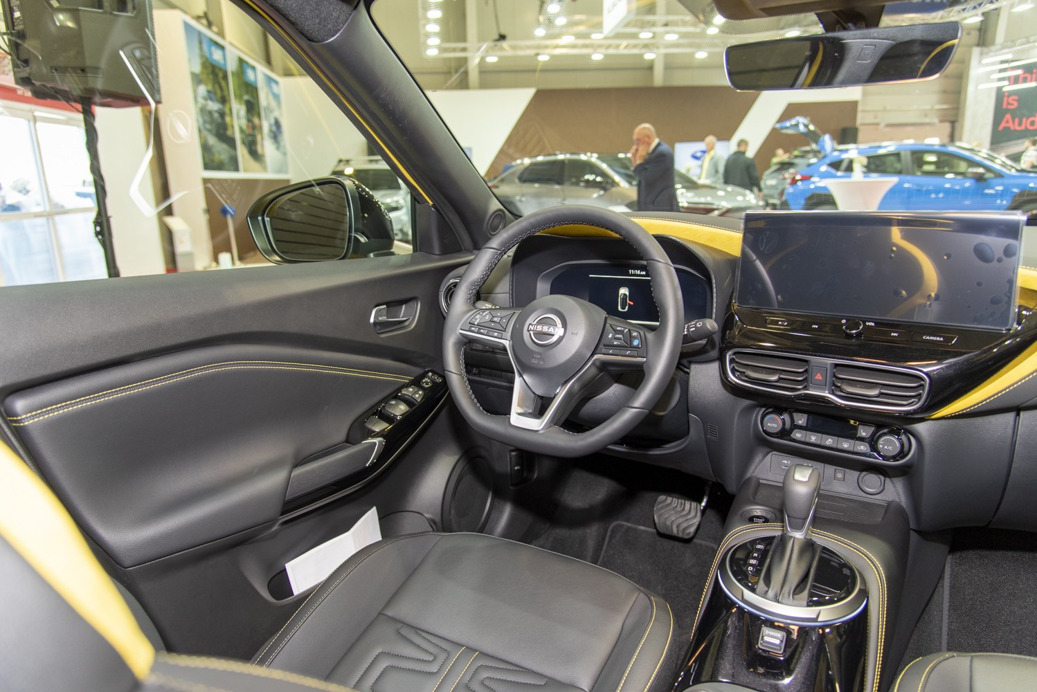 Modern digital cockpit and touchscreen interface with black leather seats
