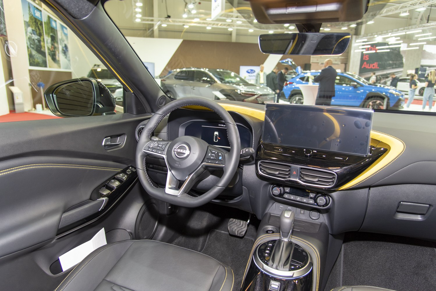 Modern digital dashboard and multifunction steering wheel with detailed stitching