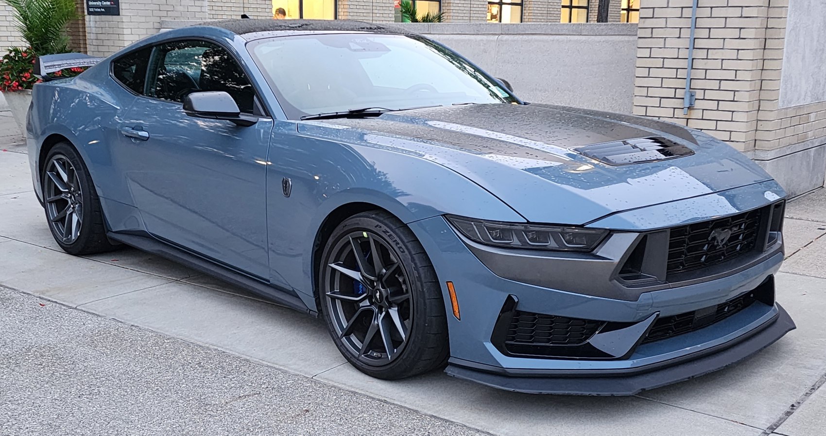 Front side with sharp headlights and sporty grille