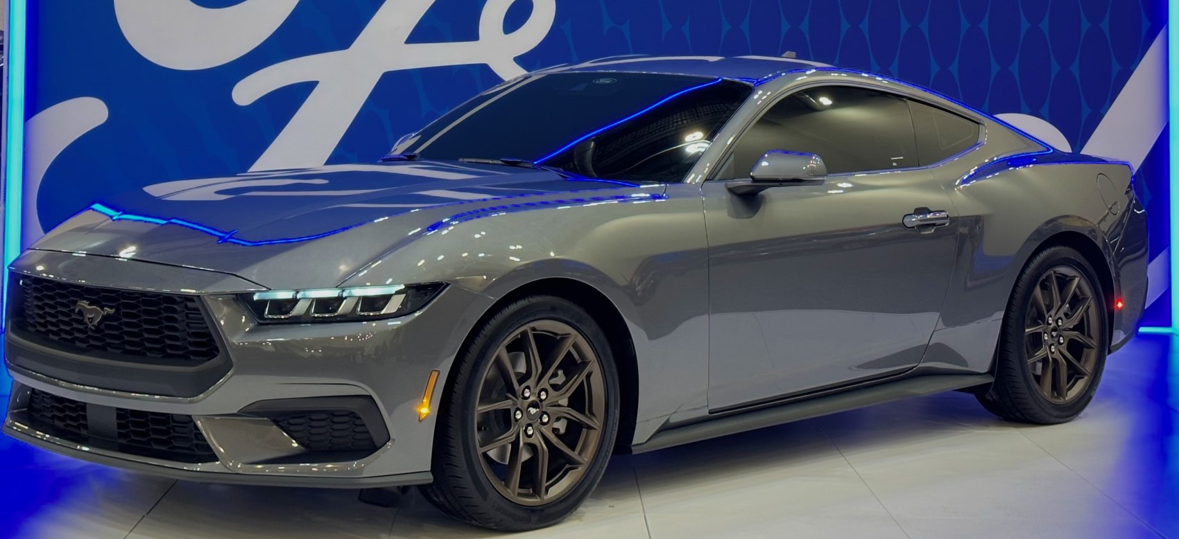 Sleek grey coupe with tri-bar LED headlights and aerodynamic design