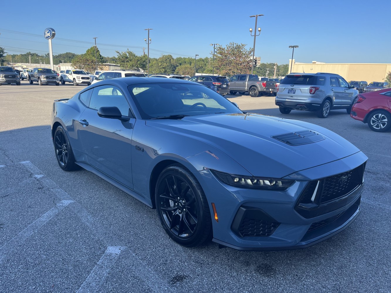 Sporty coupe with 5.0 badge, aggressive front grille, sleek headlights