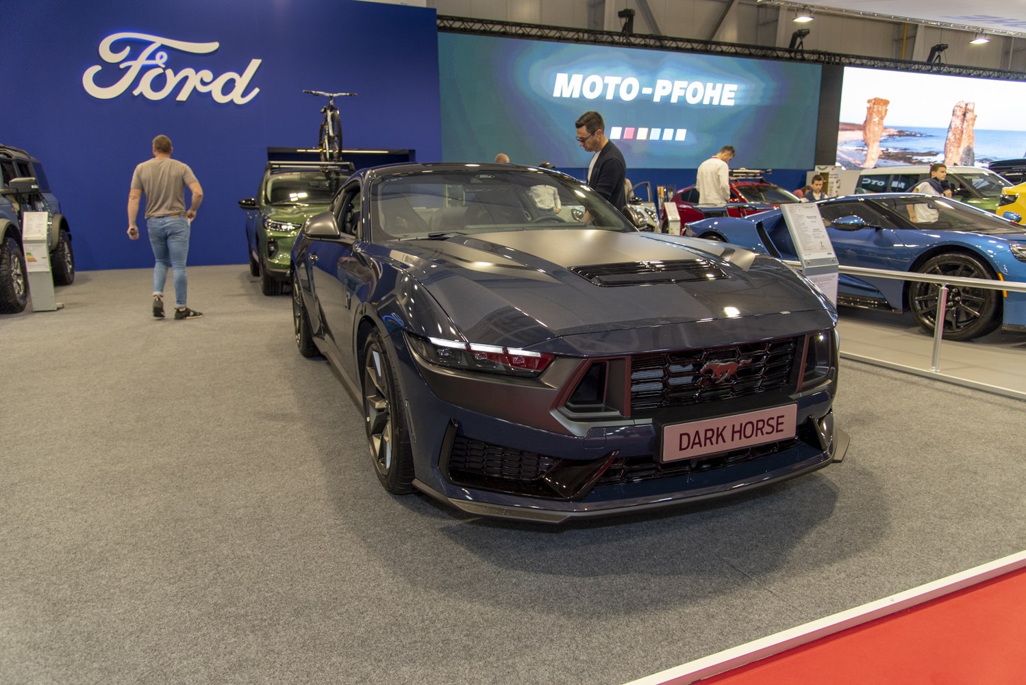 Aggressive front view with LED headlights and Dark Horse grille