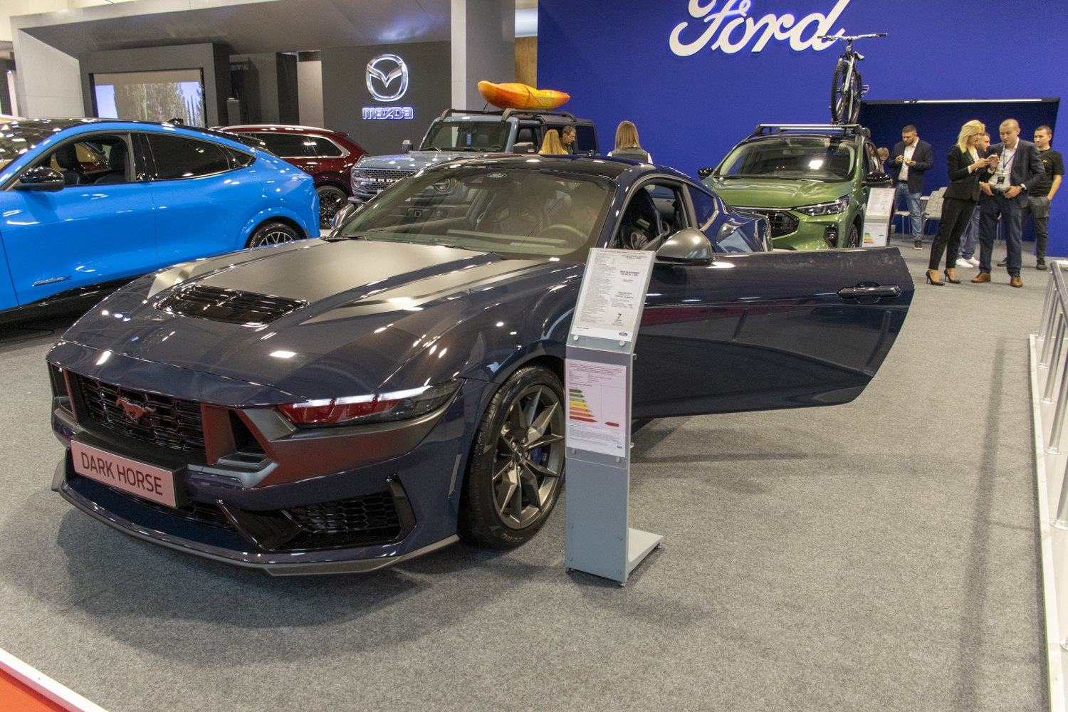 Aggressive front grille and open driver's door design