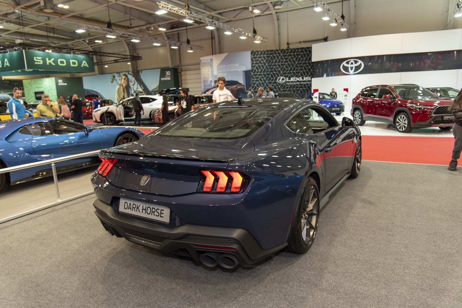 Rear view of 2024 Mustang VII Dark Horse with distinct triple vertical taillights
